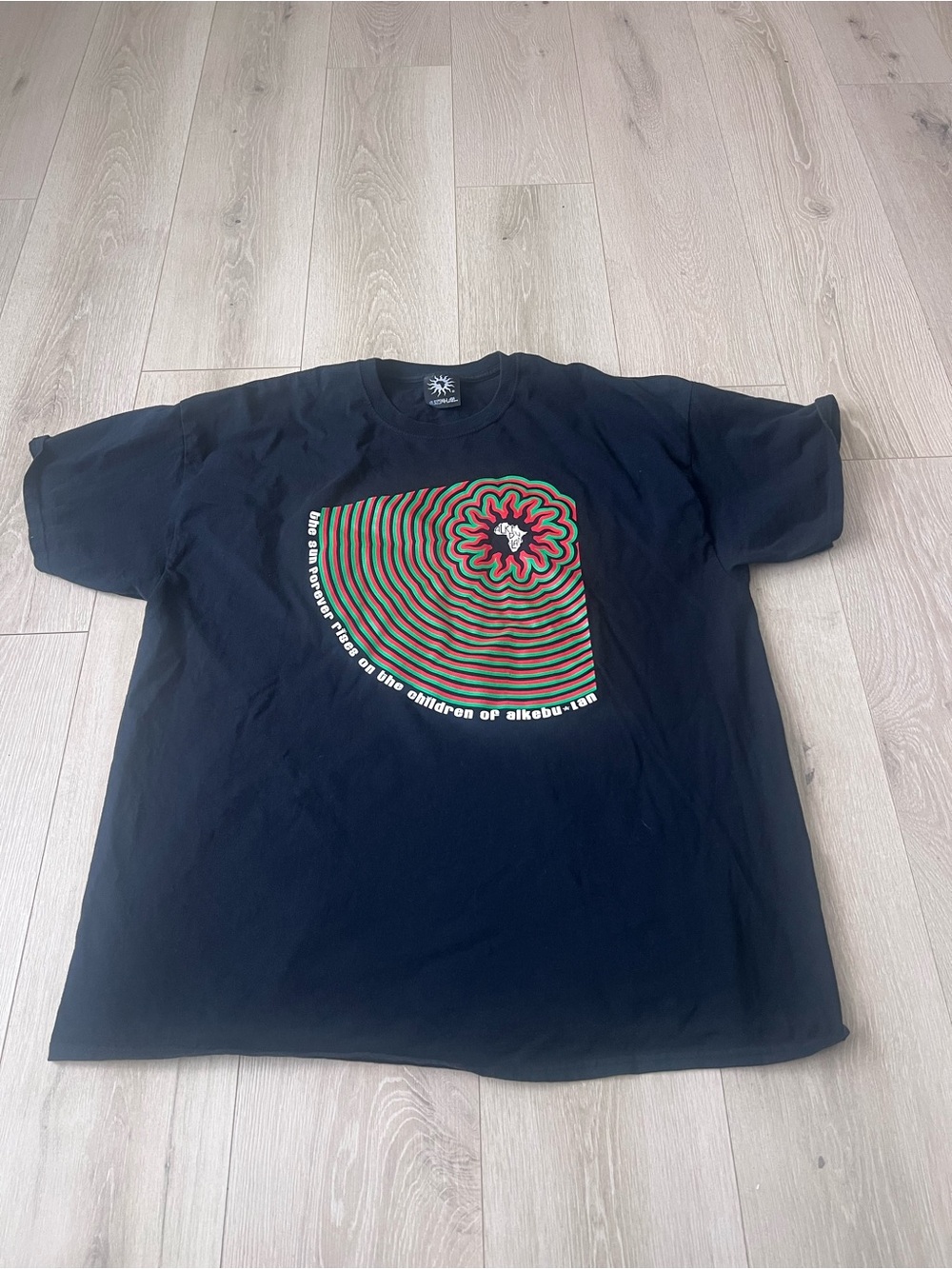 Black Short Sleeve Graphic Tee with Red & Green Spiral Flower